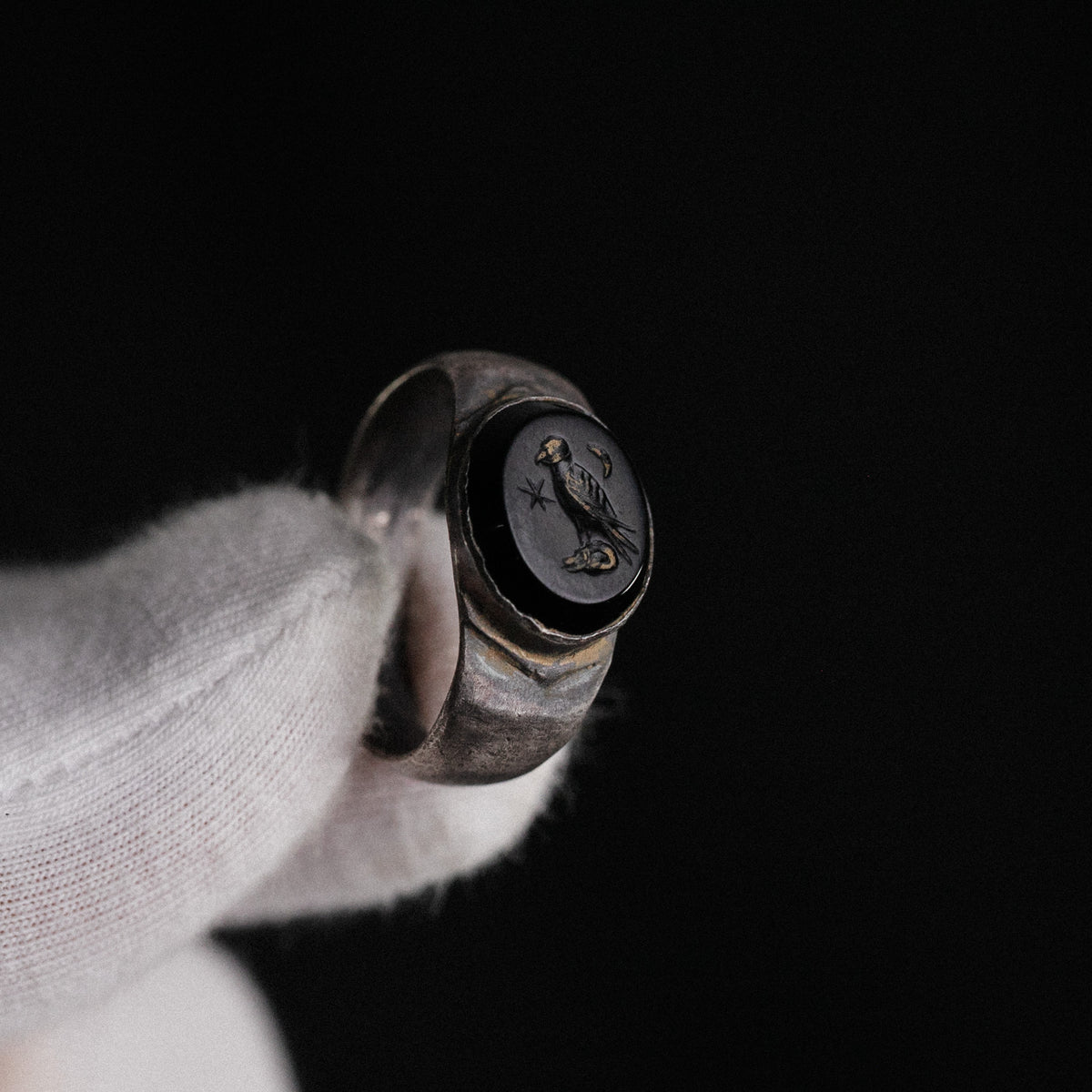 Detail of Roman silver ring Numerius Aquilus highlighting gold-filled lines in the intaglio